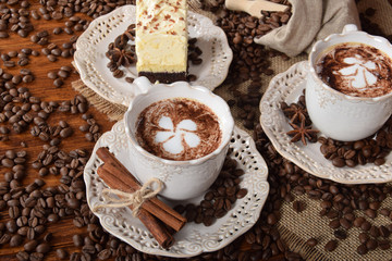 coffee with milk foam in the shape of a flower in a retro cups