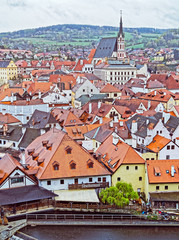 Fototapeta na wymiar CZECH KRUMLOV, CZECH REPUBLIC - APRIL 17, 2017: View of the city in the spring. It's raining. The historical center of the city in 1992 is listed as a UNESCO World Heritage Site.
