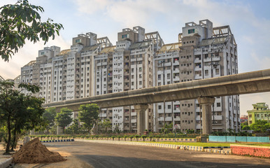 Fototapeta na wymiar High rise city residential buildings with under construction over bridge at Kolkata, India.