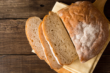 Fresh baked bread on wooden table