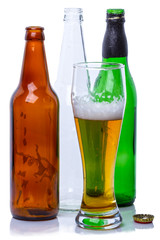  Glass of beer and empty bottles