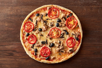 delicious italian pizza served on wooden table