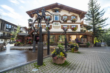 Eurpean style lodge and fountain in a beautiful mountain village - 171072471
