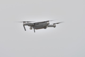 gray drone in flight