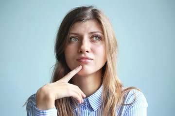 Fototapeta premium Thoughtful woman with hand and finger on chin