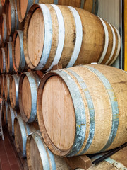 Wine barrels stacked  in the old cellar