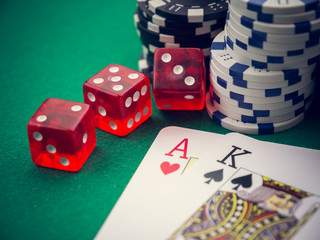 ace and king poker cards and cubes and casino chips 