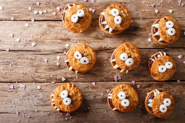 Toothed monsters of cookies close-up for Halloween. Horizontal view from above