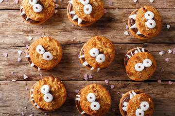 Halloween background: cookies monsters close-up. Horizontal view from above