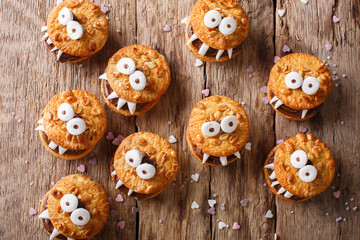 Peanut biscuit monsters for Halloween close-up on the table. horizontal view from above