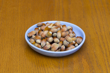 Hazelnuts in bowl top view