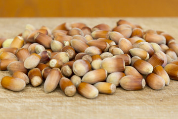 Hazelnut. Fresh organic filbert. Nuts on wooden background.
