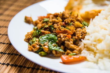 Rice topped with stir-fried pork and basil