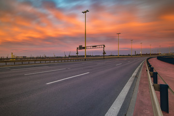 Fototapeta premium The road leading to Szczecin after sunset, traces of lights of cars