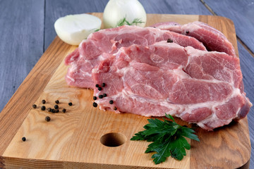 Raw meat on wooden Board