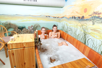 Beautiful women in a beer spa.