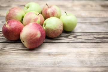 Autumn apples on a wooden rustic background. Food background