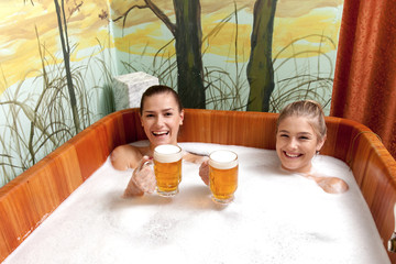 Beautiful women in a beer spa.