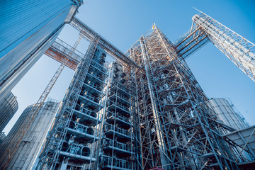 Fototapeta premium Modern silos for storing grain harvest. Agriculture.