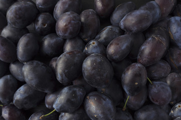 Fresh plums background.