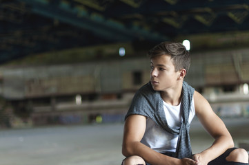 attractive young man in an old building