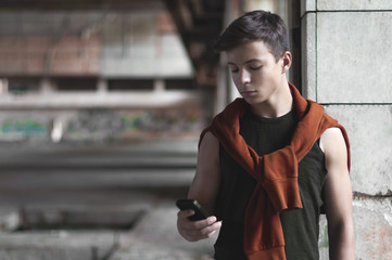 Fototapeta premium young man with telephone in old building