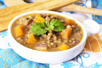 delicious lentil stew with wood cutlery