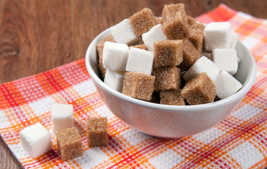 still life of cubes of white and brown sugar