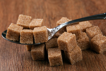 tablespoon with cubes of brown sugar