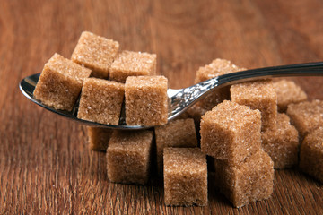 tablespoon with cubes of brown sugar