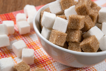 still life of cubes of white and brown sugar