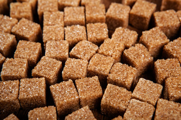 background of cubes of brown sugar