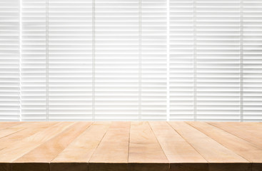 Wood table top with blur window shutters curtain background