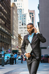 Young African American businessman traveling, working in New York