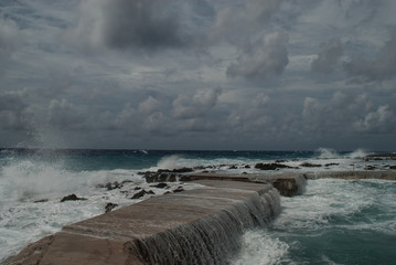 Hurricane Irma as she passes through the Caribbean. This shot was taken from the coastline of Grand Cayman where the stormy conditions created a violent ocean. 