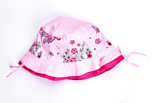 Baby-girl summer pink hat. Infant girl light pink flower print panama isolated on white background. Childs brand summer headwear on sale.