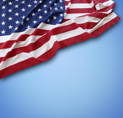 Obraz premium American flag on blue background. Copy space