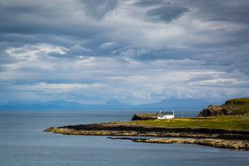 Fototapeta na wymiar view towards a remote cottage on the isle of skye