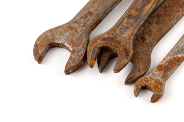 old rusty spanners on white background