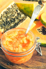 Slices of sweet papaya on wooden background