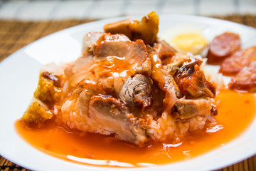 Barbecued red pork and crispy pork in sauce with rice