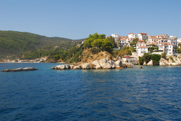 Skiathos town on Skiathos Island, Greece. Beautiful view of the old town with boats in the harbor.