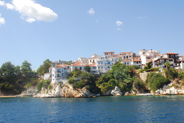Fototapeta premium Skiathos town on Skiathos Island, Greece. Beautiful view of the old town with boats in the harbor.