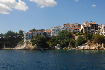 Fototapeta premium Skiathos town on Skiathos Island, Greece. Beautiful view of the old town with boats in the harbor.