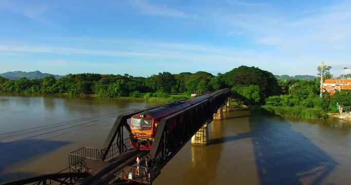 The train is passing through the Death Railway Bridge over the River Kwai in Kanchanaburi. During World War Two Japan constructed railway from Thailand to Buma This is now know the Death Railway.
