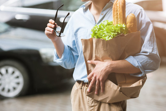 Healthy food for male. Shopping pedestrian. Unrecognizable man in selective focus outdoors, modern stylish hipster