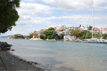 Skiathos town on Skiathos Island, Greece. Beautiful view of the old town with boats in the harbor.