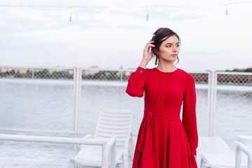 Obraz premium fashion portrait of happy beautiful girl in red dress