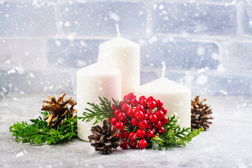 Christmas compositions with candles and cedar branches, holidays background. Space for text