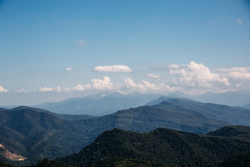 Beautiful Mountain landscape with low clouds